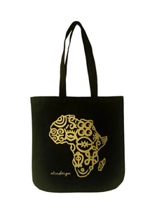 Black cotton tote bag with a gold Africa map outline design and the brand name 'Adinkra' printed on the front.