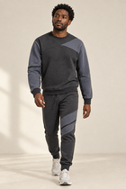 Grey-on-grey tracksuit with a relaxed walking pose